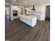 Modern kitchen featuring a large island, stainless appliances, and white cabinets at 427 Rising Star Dr, Clayton, NC 27520