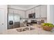 Modern kitchen with stainless steel appliances and granite countertops at 444 Belgian Red Way, Wake Forest, NC 27587
