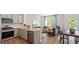 Open concept kitchen with stainless steel appliances and granite countertops at 444 Belgian Red Way, Wake Forest, NC 27587