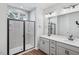 Modern bathroom featuring double vanity, gray-toned decor, a walk-in glass shower with stylish tile work at 602 Hillfarm Dr, Wake Forest, NC 27587