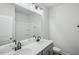 Well-lit bathroom with double sinks, a large mirror, and a shower-tub combination at 602 Hillfarm Dr, Wake Forest, NC 27587