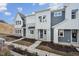 Three-unit townhouse building, gray and white siding at 602 Hillfarm Dr, Wake Forest, NC 27587