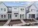 Gray and white exterior of townhouses with front porches at 602 Hillfarm Dr, Wake Forest, NC 27587