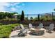 Inviting outdoor fire pit area with Adirondack chairs, set in a beautifully landscaped community space at 602 Hillfarm Dr, Wake Forest, NC 27587