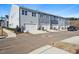 Row of attached garages for townhomes, with landscaping and a paved driveway at 610 Hyperion Aly, Wake Forest, NC 27587