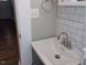 Small bathroom with pedestal sink and white tile at 618 N Third St, Mebane, NC 27302