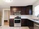 Modern kitchen with stainless steel appliances and granite countertops at 618 N Third St, Mebane, NC 27302