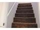 Carpeted staircase leading to the upper level at 618 N Third St, Mebane, NC 27302