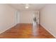 Spacious bedroom with hardwood floors and access to other rooms at 6301 King Lawrence Rd, Raleigh, NC 27607