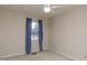 Cozy bedroom with window and blue curtains at 6409 New Market Way, Raleigh, NC 27615
