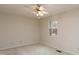 Spacious bedroom with ceiling fan and large window at 6409 New Market Way, Raleigh, NC 27615