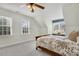 Bedroom with wood bed frame and carpet floor at 7400 Duncans Ridge Way, Fuquay Varina, NC 27526