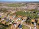 Aerial image showcasing a neighborhood with houses nestled among trees and roads at 75 Sorrel Dr, Franklinton, NC 27525