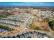 Aerial view of a residential neighborhood with houses and open space at 8065 Gilano Dr, Raleigh, NC 27603