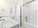 Double vanity bathroom with a separate tub and shower at 8065 Gilano Dr, Raleigh, NC 27603