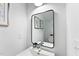 Small bathroom with a vanity and a toilet, featuring a modern mirror at 8610 Brushfoot Way # 106, Raleigh, NC 27616