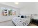 Spacious bedroom with large windows and a king-size bed at 8610 Brushfoot Way # 106, Raleigh, NC 27616
