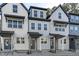 Charming townhomes feature modern exteriors with covered entrances and beautiful architectural details at 8610 Brushfoot Way # 106, Raleigh, NC 27616