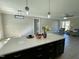 Spacious kitchen with island, modern lighting, and hardwood floors at 873 Gilbert Rd, Benson, NC 27504