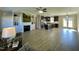 Open concept living room and kitchen with hardwood floors at 873 Gilbert Rd, Benson, NC 27504