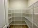 Walk-in pantry with ample shelving for storage at 873 Gilbert Rd, Benson, NC 27504