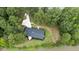 Aerial view of a renovated ranch home near a pond at 889 Burlington Rd, Roxboro, NC 27573