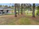 Spacious backyard with a deck overlooking a tranquil lake at 889 Burlington Rd, Roxboro, NC 27573