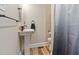 Small bathroom with pedestal sink and shower at 889 Burlington Rd, Roxboro, NC 27573