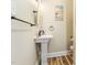 Small bathroom with pedestal sink and shower at 889 Burlington Rd, Roxboro, NC 27573