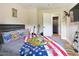 Bedroom with a bed, guitar, and access to bath at 889 Burlington Rd, Roxboro, NC 27573