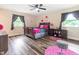 Bedroom with a double bed and pink accents at 889 Burlington Rd, Roxboro, NC 27573