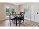 Bright dining area with a round table and four chairs at 889 Burlington Rd, Roxboro, NC 27573