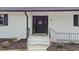 Inviting front entrance with dark door, and white brick exterior at 889 Burlington Rd, Roxboro, NC 27573