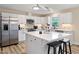 Modern kitchen with white cabinets, stainless steel appliances, and an island at 889 Burlington Rd, Roxboro, NC 27573