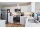Kitchen with stainless steel appliances and white shaker cabinets at 889 Burlington Rd, Roxboro, NC 27573