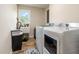 Bright laundry room, washer, dryer, utility sink at 889 Burlington Rd, Roxboro, NC 27573