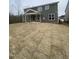 Backyard features a covered porch and newly laid sod at 9349 Kitchin Farms Way # 463, Wake Forest, NC 27587