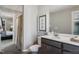 Well-lit bathroom with vanity, framed art, and a shower curtained shower at 9349 Kitchin Farms Way # 463, Wake Forest, NC 27587