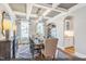 Elegant dining room featuring a coffered ceiling, hardwood floors, and plenty of natural light from large windows at 9349 Kitchin Farms Way # 463, Wake Forest, NC 27587