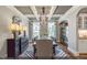 Dining room with a striking coffered ceiling, hardwood floors, large windows, and a modern light fixture at 9349 Kitchin Farms Way # 463, Wake Forest, NC 27587