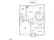First floor plan featuring a living room, dining room, kitchen, and guest bedroom at 9349 Kitchin Farms Way # 463, Wake Forest, NC 27587