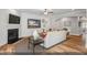 A living room with a fireplace, large screen television, and an open floor plan at 9349 Kitchin Farms Way # 463, Wake Forest, NC 27587