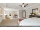 Spacious main bedroom with a tray ceiling, carpeted floors, and a sitting area at 9349 Kitchin Farms Way # 463, Wake Forest, NC 27587