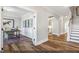 A home office features a desk, globe, area rug, and is connected to the entry hall at 9349 Kitchin Farms Way # 463, Wake Forest, NC 27587