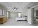 Elegant bedroom suite features a tray ceiling, ceiling fan, and ample space at 108 Cross Oaks Pl, Holly Springs, NC 27540