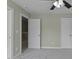 Bedroom with carpet, neutral paint and doors to other rooms at 108 Cross Oaks Pl, Holly Springs, NC 27540