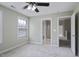 Bedroom features carpet, neutral paint, ceiling fan, and doors to other rooms at 108 Cross Oaks Pl, Holly Springs, NC 27540