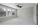 Bedroom features carpet, neutral paint, ceiling fan, and windows with blinds at 108 Cross Oaks Pl, Holly Springs, NC 27540