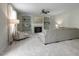 Inviting living room with built-in bookshelves, a fireplace, and comfortable seating at 108 Cross Oaks Pl, Holly Springs, NC 27540