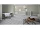 Spacious loft area with desk, chair, sofa, and side tables with gray carpet at 108 Cross Oaks Pl, Holly Springs, NC 27540